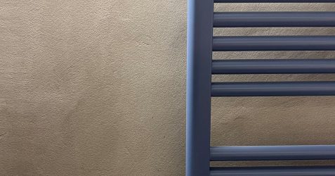 Close-up of Terrazzo GraniTech textured surface showing superior alternative to microcement for addressing bathroom pros and cons with enhanced durability