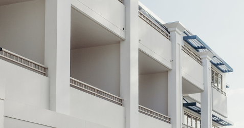 Building facade finished with Terrazzo GraniTech, a modern and durable option among types of exterior wall finishes.