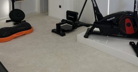 Terrazzo Granitech microtopping floor in home gym showing seamless matte finish and durability compared to epoxy flooring